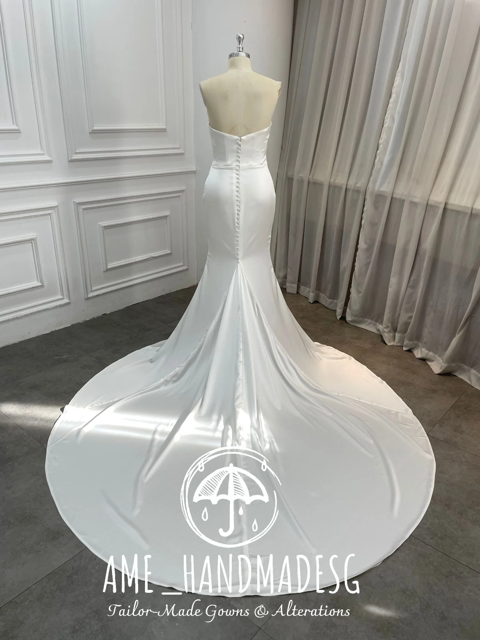 Pure Grace: A Minimalist Satin Mermaid Gown with Buttoned Train - Image 2