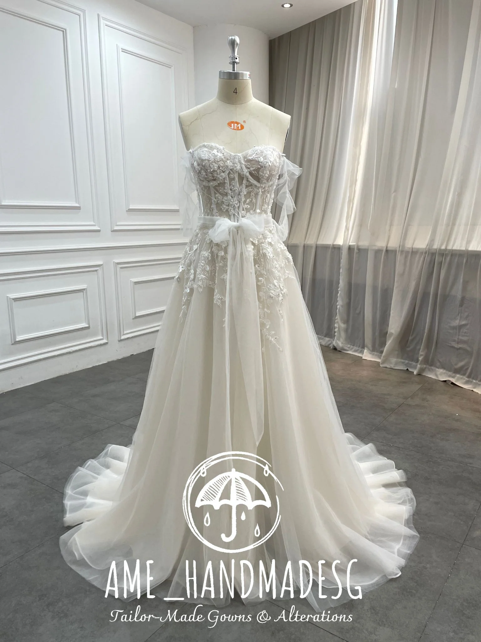Ethereal Whisper: A Strapless Tulle Bridal Gown with Floral Lace