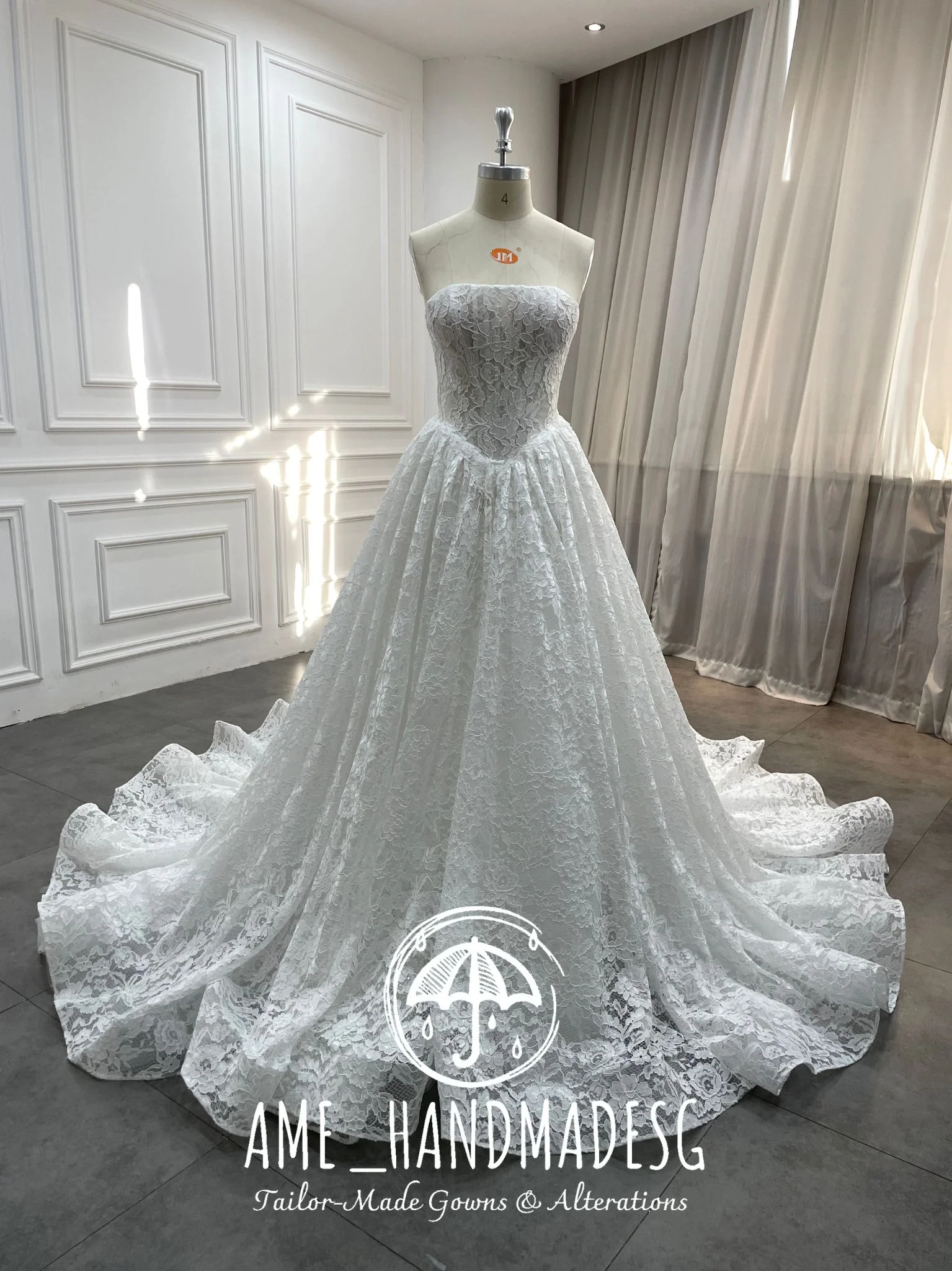 Lace Reverie: A Timeless Strapless Ball Gown in Pure Romance